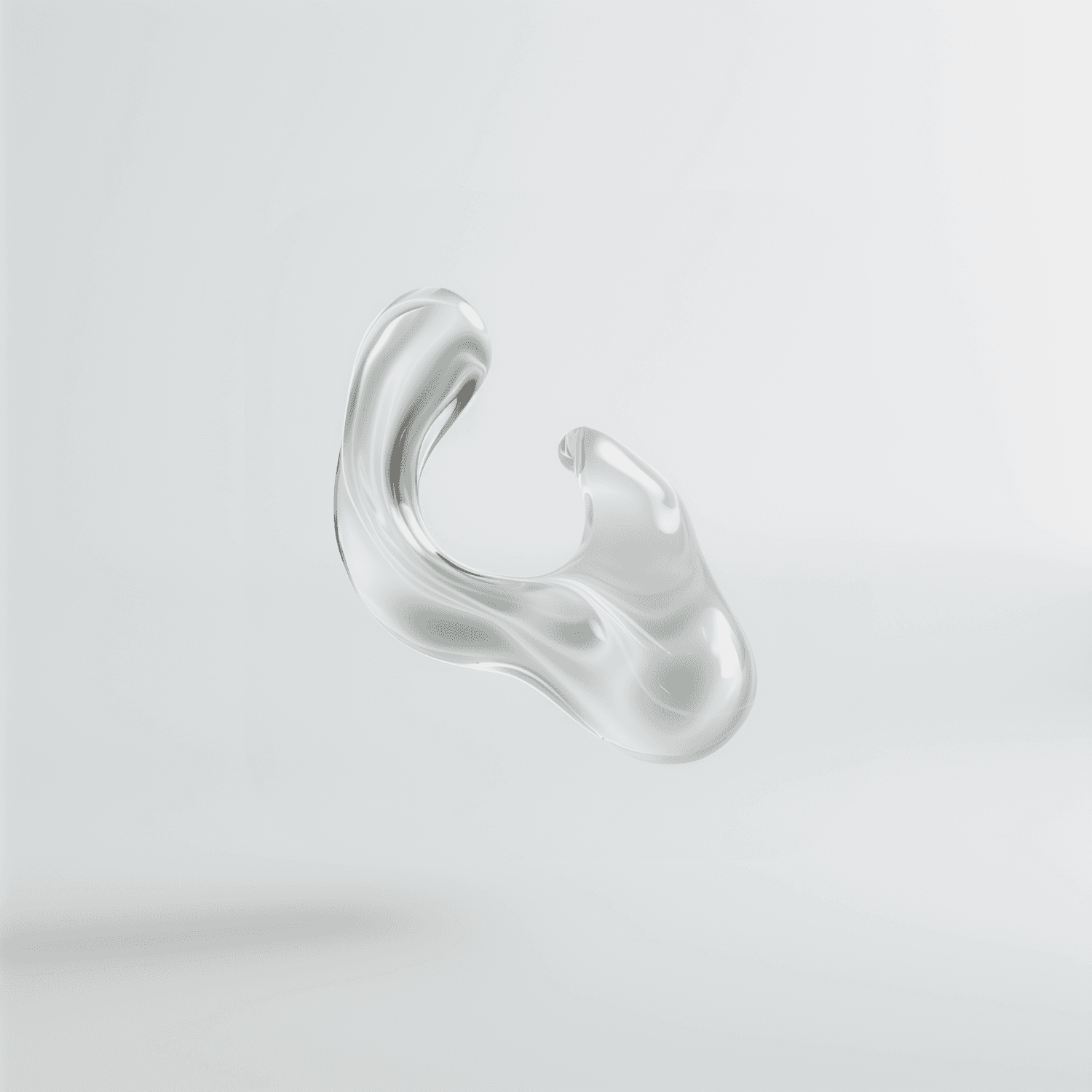 Translucent abstract sculpture with fluid curves on a pale grey ground